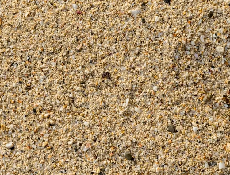 Fijne, zandkleurige textuur van gestabiliseerd zand (stabilisé)