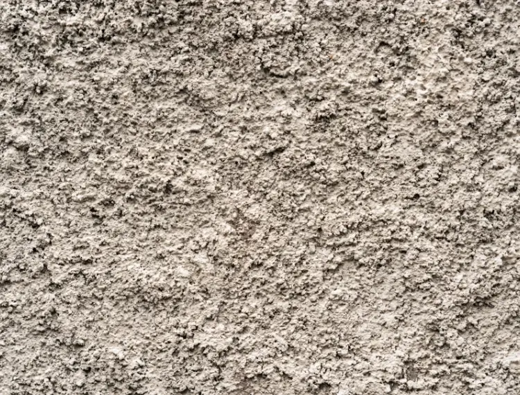 Ruwe grijze textuur van een mengsel van zand en cement